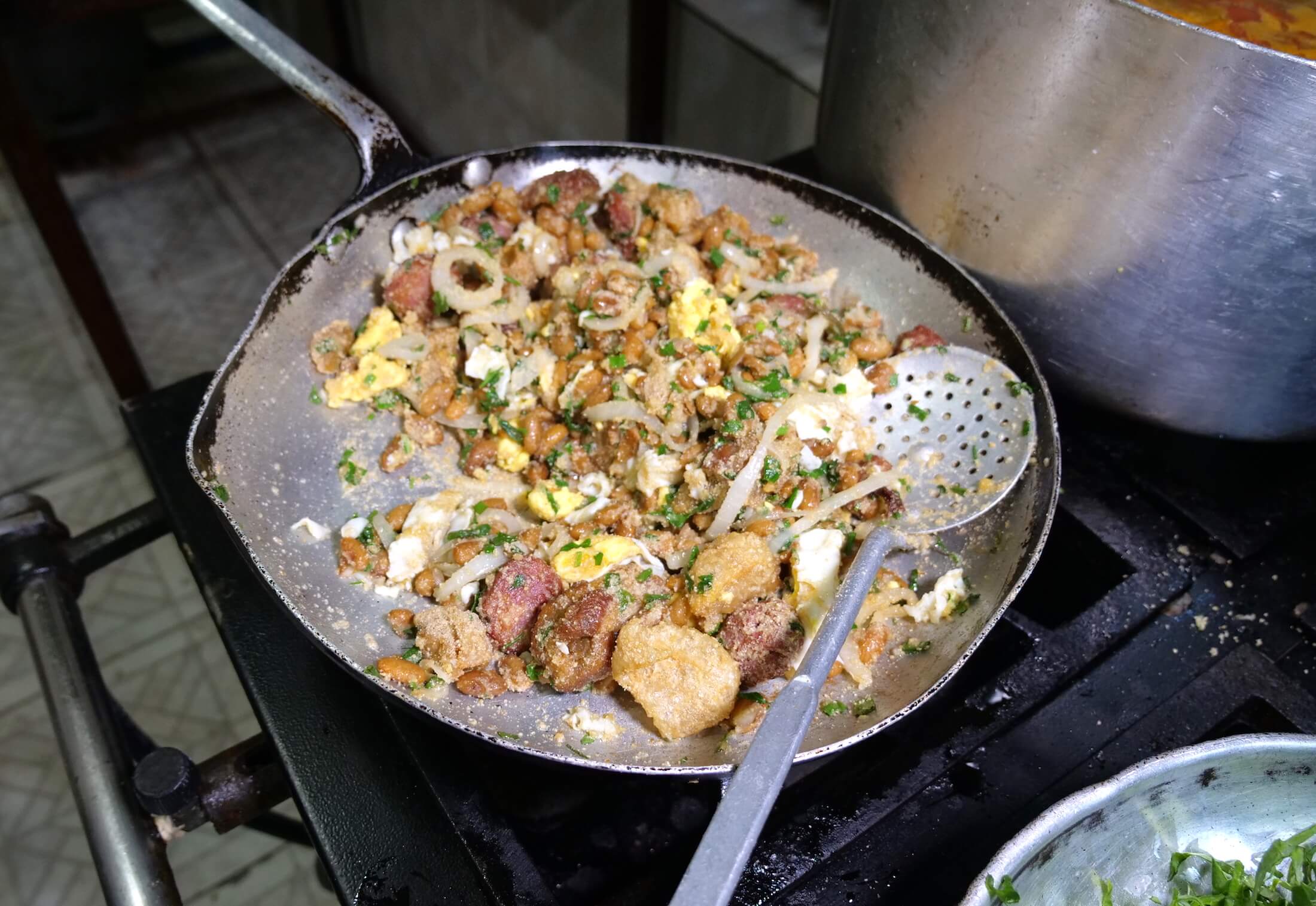 The amount of fried ingredients in Feijao Tropeiro makes for an aromatic journey of wonder.